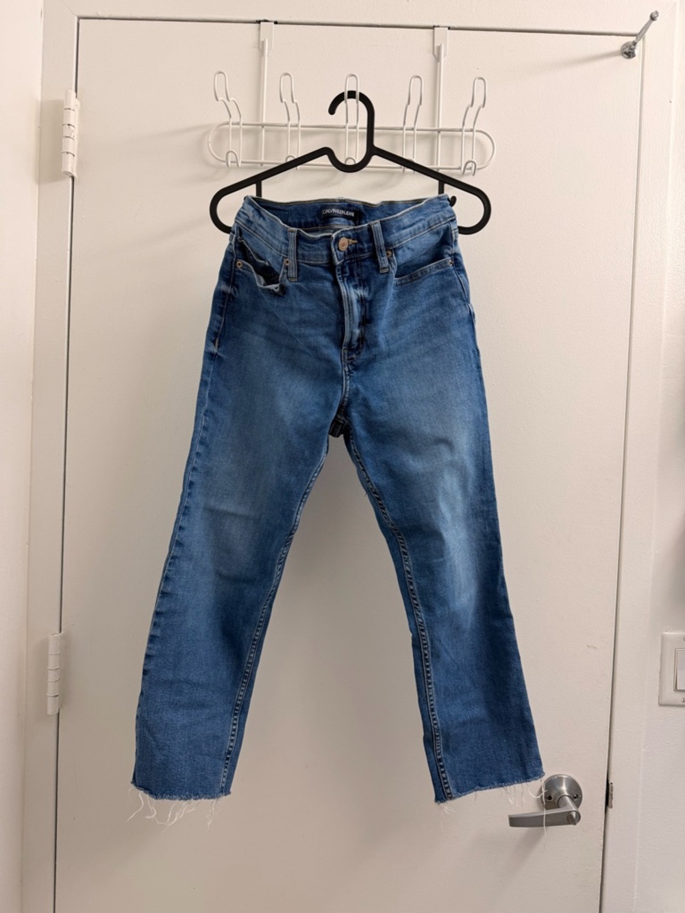 calvin klein high rise straight jeans with raw hem (size 27)